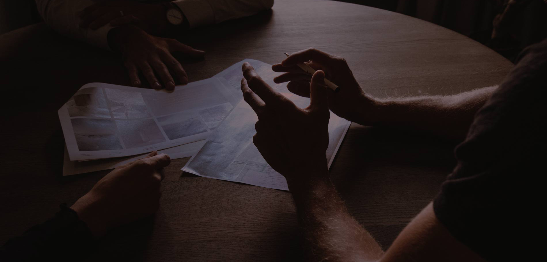 Hands of people meeting around a table